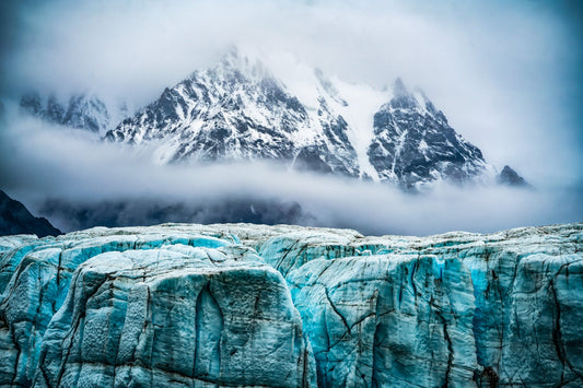 Donjek Glacier stretching through rugged mountain terrain under dramatic skies in the Yukon wilderness.