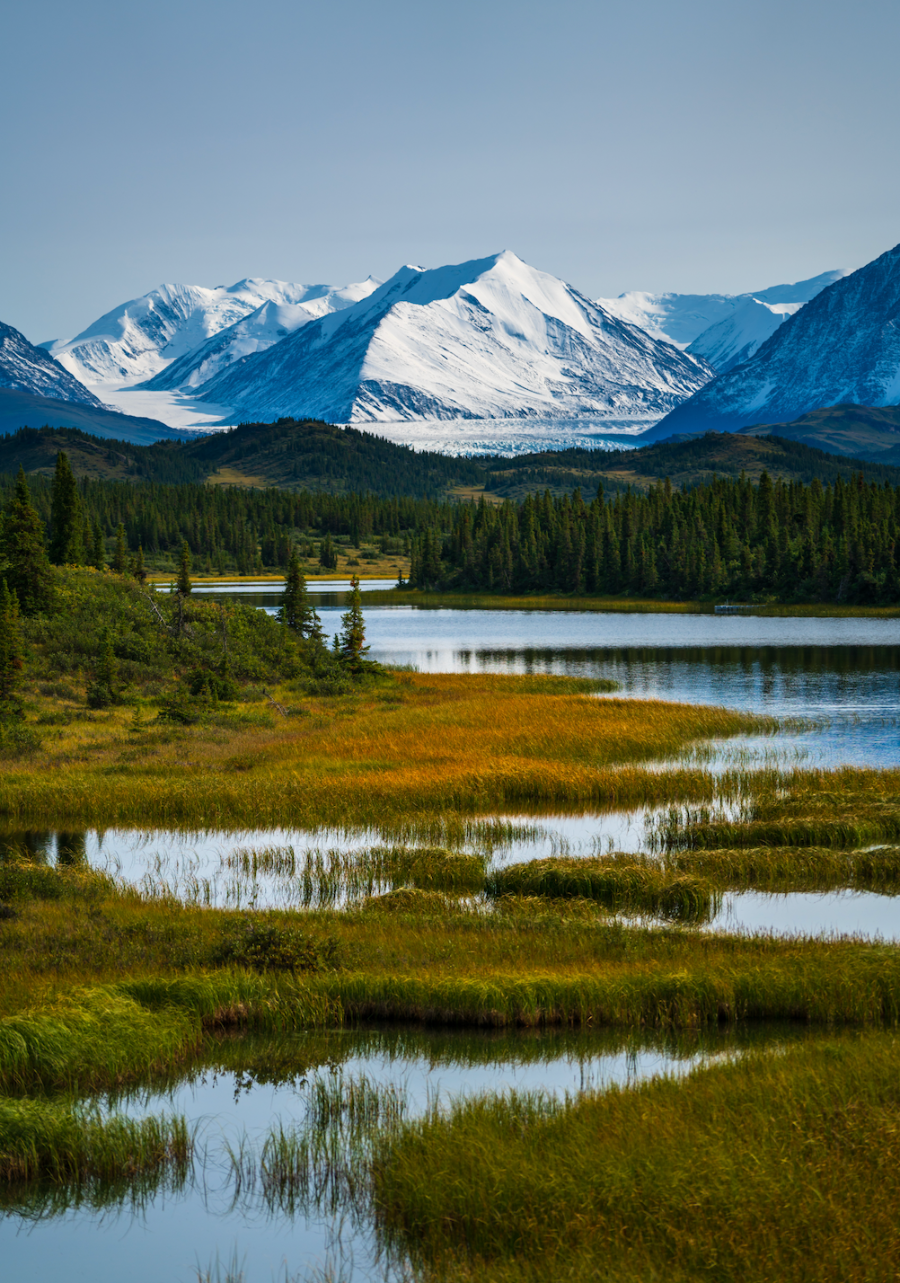 A breathtaking view of a towering mountain in Kluane National Park, showcasing the park's stunning alpine landscapes and pristine wilderness.
