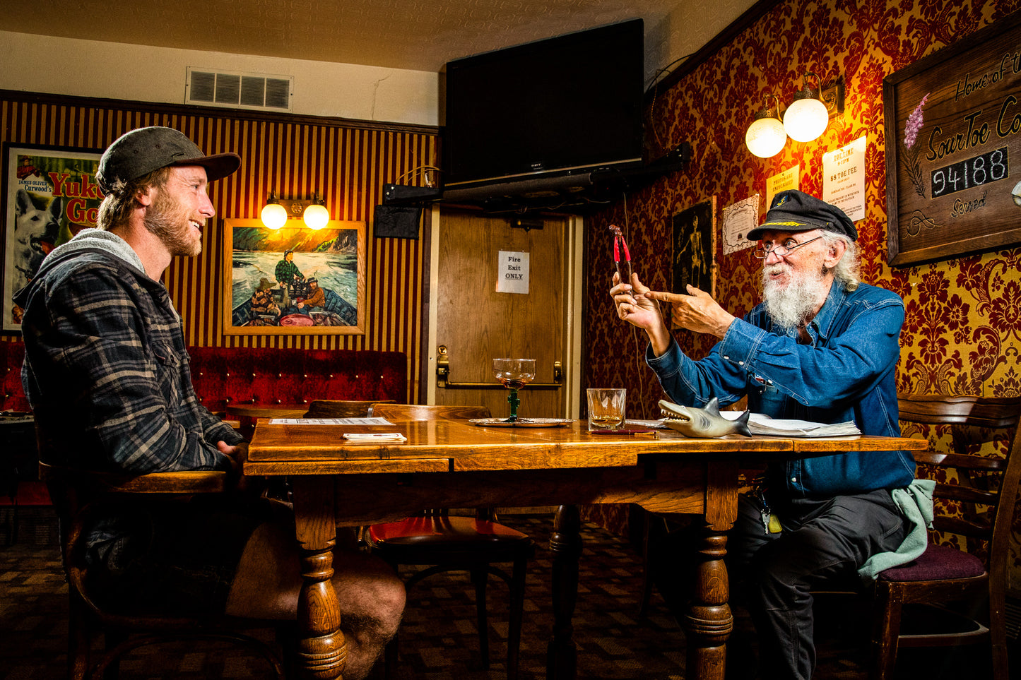 The legendary Sourtoe Cocktail served in Dawson City, Yukon – a daring drink with a preserved human toe at its heart. A quirky and unforgettable Yukon tradition that challenges adventurers to 'Drink it fast, or drink it slow, but your lips must touch the toe!