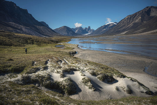 Water front view of mountains on Akshayuk Pass, Baffin Island, Canada