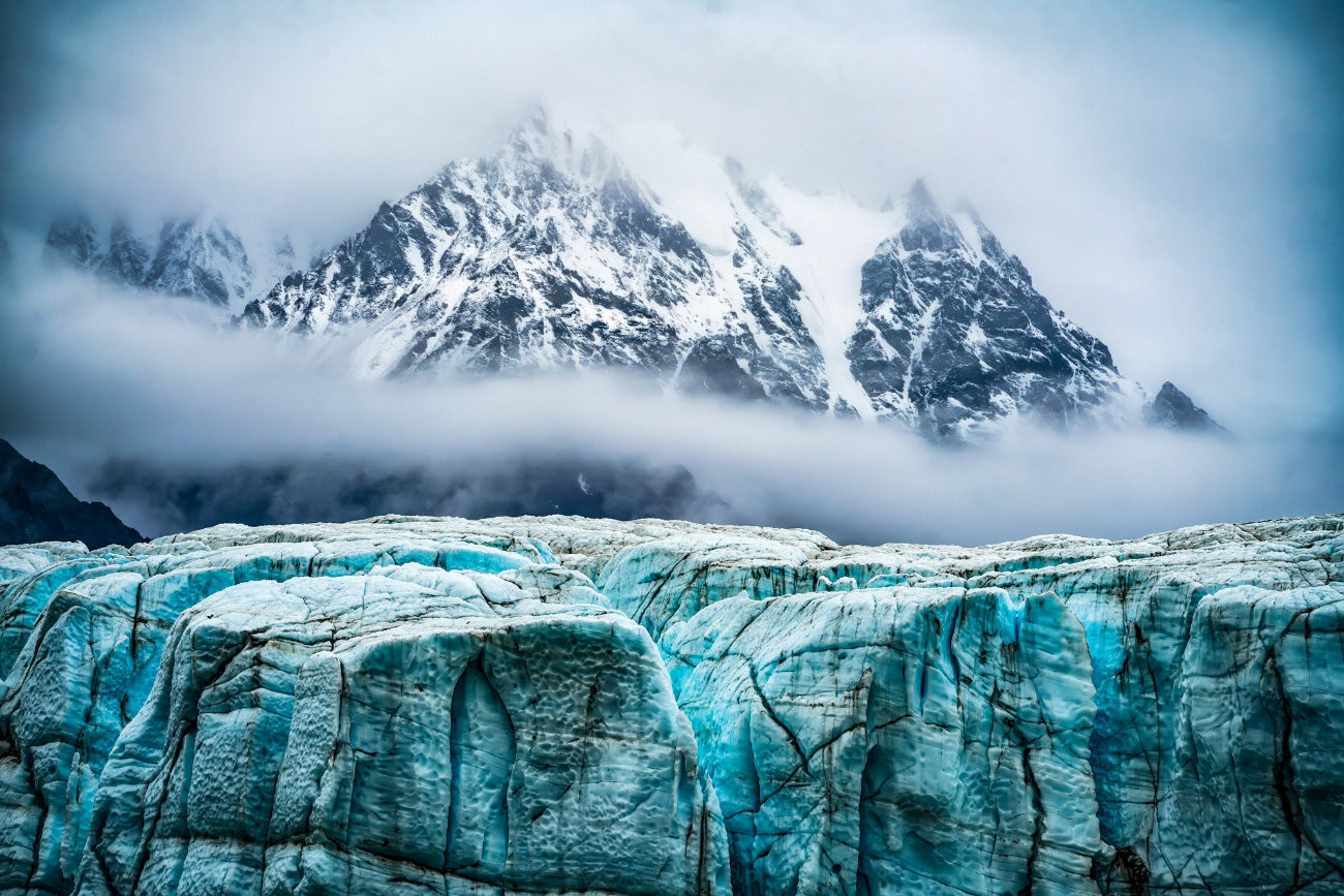 Donjek Glacier stretching through rugged mountain terrain under dramatic skies in the Yukon wilderness.