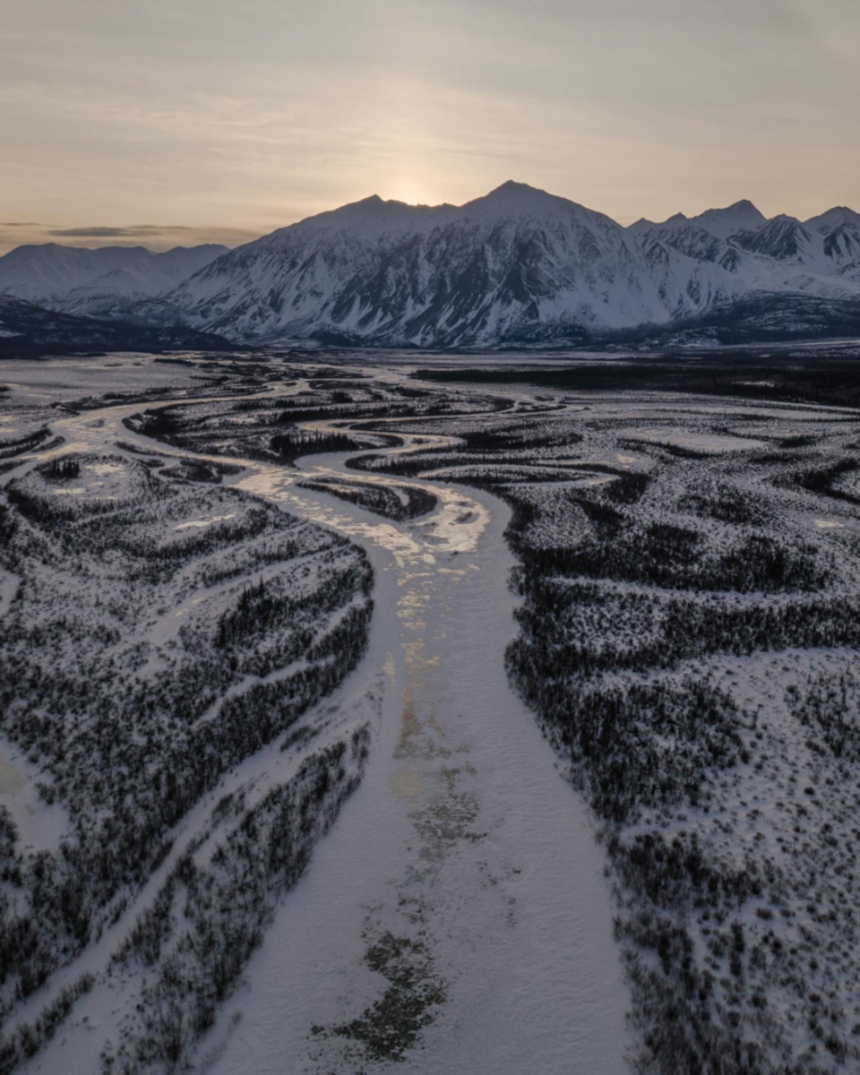 Aerial view of a snow-covered maze with mountains in the background, Kluane National Park