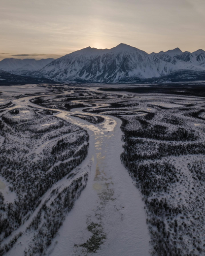 Aerial view of a snow-covered maze with mountains in the background, Kluane National Park