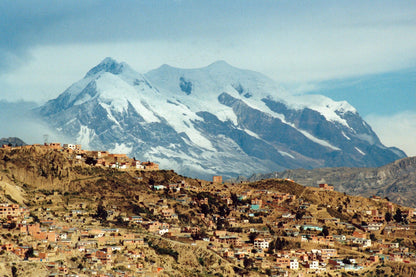 Our expedition begins in La Paz, beneath the snow-covered slopes of Illimani, before we head north into Bolivia’s Cordillera Real
