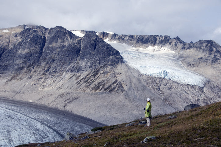 Hiker overlooking Samuel Glacier British Columbia Canada