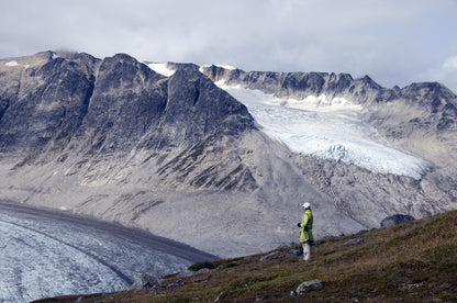Hiker overlooking Samuel Glacier British Columbia Canada