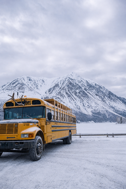 The converted school bus aka The Squatch Bus, in winter parked at Kathleen Lake, The Yukon