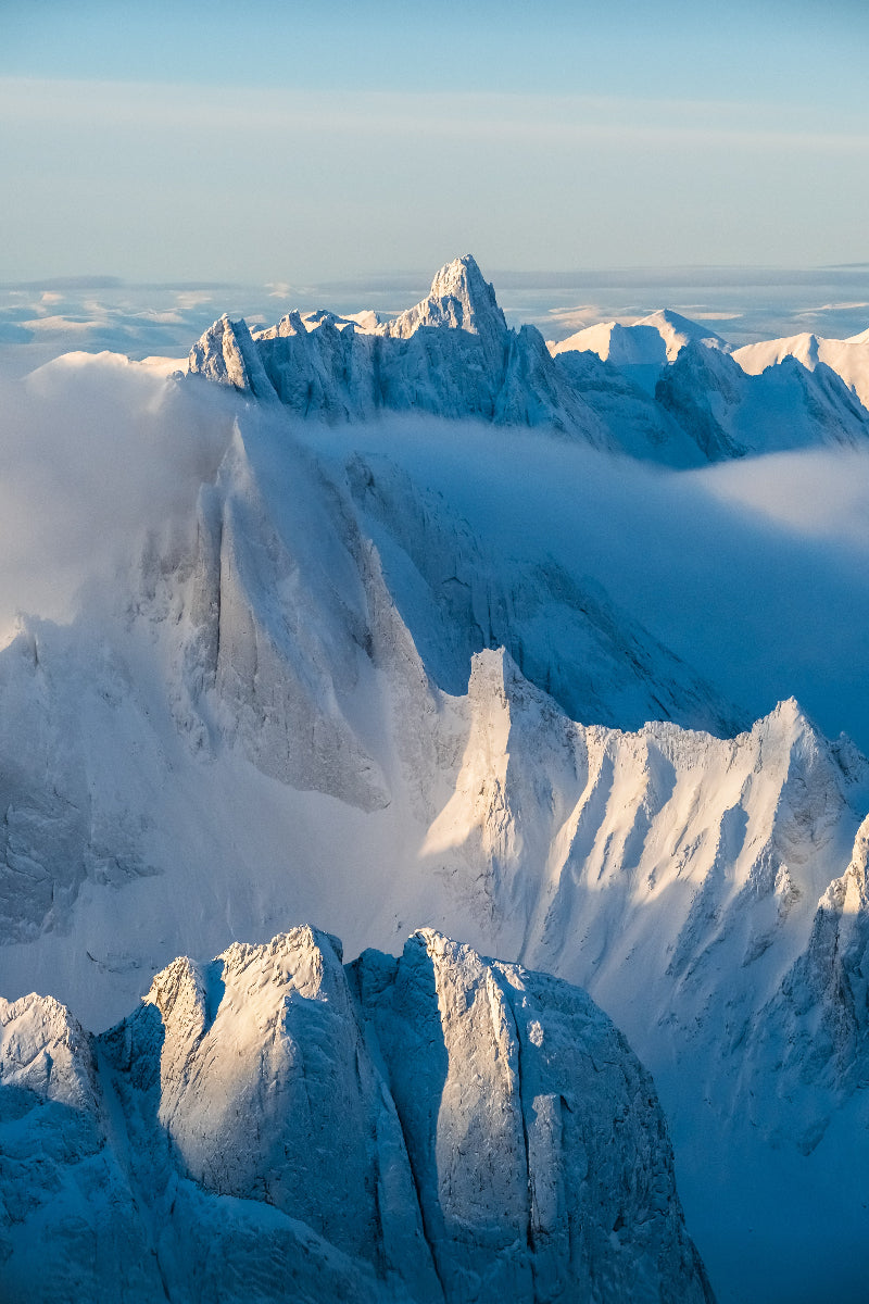 Snow-covered mountain peaks Tombstone Territorial Park Yukon with a clear sky