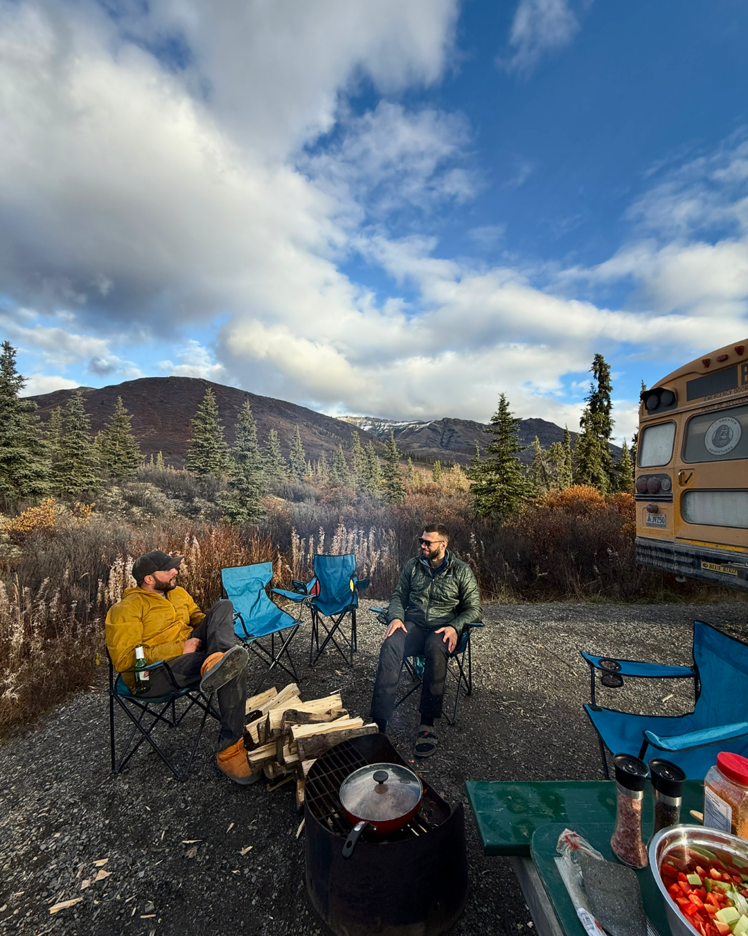 Campfire setup with Squatch Bus in background, Yukon Tombstone Campground