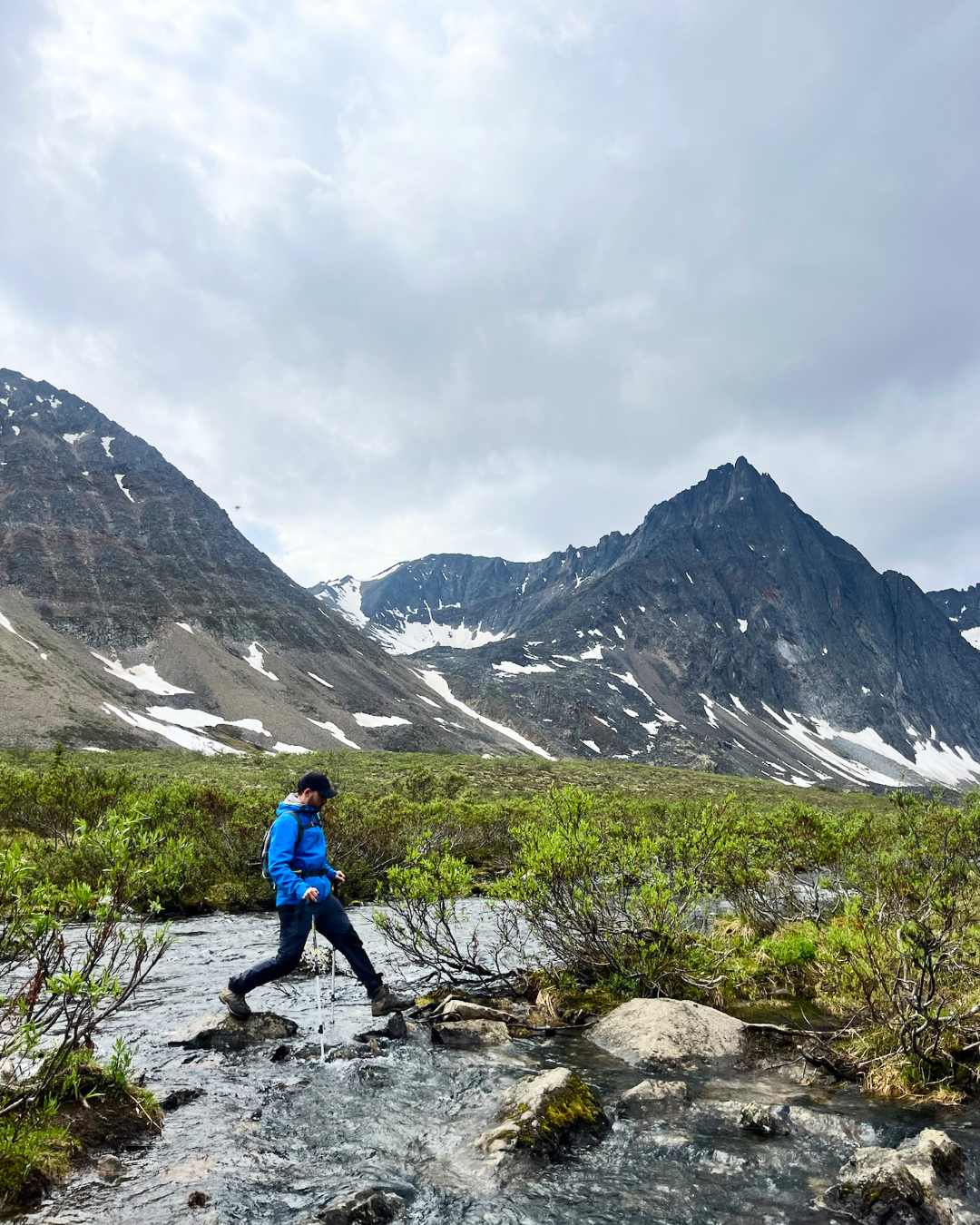 Hiker creek crossing Grizzly Lake Tombstone Yukon