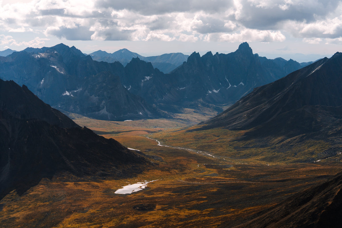 Wide valley framed by jagged Tombstone mountains, Yukon Canada